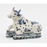 A rare 18th century Japanese Arita figure of a cow, modelled after the Delft model for the Dutch