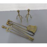 Pair of brass fire dogs and a brass fireside companion set. (6)