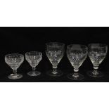 Set of three knop stemmed large wine glasses and two cut glass champagne glasses (5)