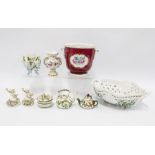 A collection of floral encrusted porcelain trinkets to include vases, miniature teapots, etc,