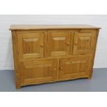 Pine sideboard / cabinet, rectangular top over three small cupboard doors with two larger