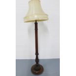 Mahogany standard lamp with carved details to the circular base, complete with shade