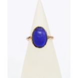 An early 20th century blue scarab plaque ring,the yellow metal band with an indistinct hallmark,