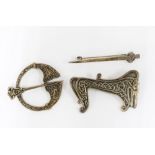 An unusual lain MacCormack Iona silver brooch of mythical beast form with celtic art knotwork
