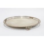 George III silver salver, circular with a pierced rim, on three shell cast feet, Ebenezer Coker,