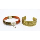 Moss agate coloured jadeite bangle with white metal mounts and a brass dragon pattern cuff bangle (