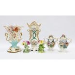 A collection of floral encrusted porcelain vase (6) 26cm.