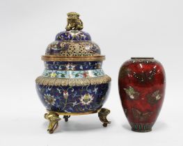 Cloisonne censer and cover and a small red lacquered cloisonné vase, (with area of damage) (2) 20cm.