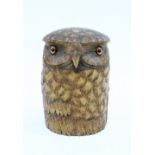 Carved maple tobacco jar in the form of an owl, the detacahable lid with inset eyes, 15cm high