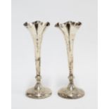 A pair of late Victorian silver vases, William Hutton & Sons, London 1900, weighted bases, 14cm high