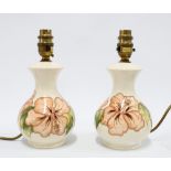 Pair of Walter Moorcroft Hibiscus pattern table lamps, 24cm (2)