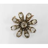 Late 19th / early 20th century diamond flower head brooch, set in unmarked gold and white metal, the