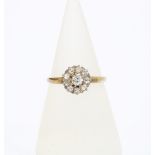 Early 20th century diamond flowerhead ring, set in yellow metal, indistinct marks to the inner band