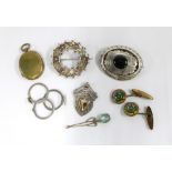 A collection of white metal brooches, a silver ring in three parts, stamped 900 and a pair of