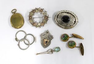 A collection of white metal brooches, a silver ring in three parts, stamped 900 and a pair of