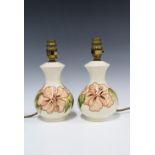 Pair of Walter Moorcroft Hibiscus pattern table lamps, 24cm (2)