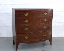 Georgian mahogany bow front chest with four graduating long drawers, brass handles, standing on