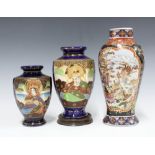 Two Japanese baluster vases and a famille noir vase (3) 24cm.