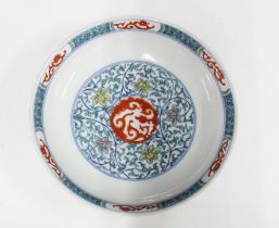 Chinese dish decorated in Doucai five coloured enamels, bearing a Kangxi mark to the base but likely