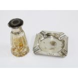 George V glass scent bottle with internal glass stopper and a silver nd tortoiseshell lid,