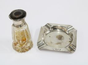 George V glass scent bottle with internal glass stopper and a silver nd tortoiseshell lid,