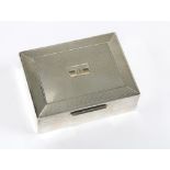 A silver cigarette box, the hinged lid with engine turned decoration, Birmingham 1954, 11 x 8cm