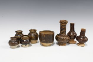 A collection of Jizhou glazed jarlets and miniature vases etc, tallest 12cm, (8)