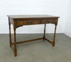 An elm and oak table, the rectangular top above two short frieze drawers, 109 x 76 x 51cm.