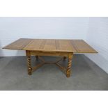 Oak extending table, 213 x 76 x 106cm.