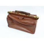 Vintage brown leather Gladstone, bag with brass mounts and canvas interior, 40 cm long