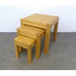 Contemporary nest of three beechwood tables, 60 x 61 x 61cm. (3)