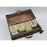 A case containing eighteen sets of Coloured Lantern Slides, subjects include British Army, Boy