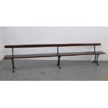 Early 20th century stained pine pew / bench with black iron supports, 330 x 73 x 28cm