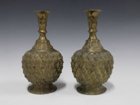 A pair of Nigerian bronze vases with prunt decoration, on circular footrims 23cm (2)