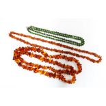 Two strands of amber beads and a double strand of jade beads, (3)