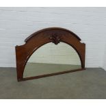 Late 19th century mahogany overmantle mirror, arched top with leaf carved centre, 126 x 77cm.
