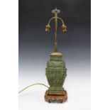 Chinese archaic bronze style table lamp, with wooden mounts and base, 56cm high
