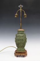 Chinese archaic bronze style table lamp, with wooden mounts and base, 56cm high