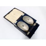 A pair of Gents silver backed brushes, cased, London 1945 (2)