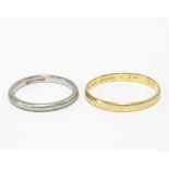 18ct gold wedding band and a platinum wedding band (2)