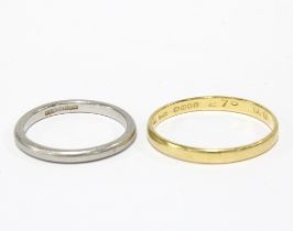 18ct gold wedding band and a platinum wedding band (2)