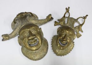 Two West African brass wall masks, with serpent headwear, open smiling mouths, longest 30cm (2)