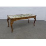 Mahogany coffee table with tapestry top, 109 x 45 x 44cm.