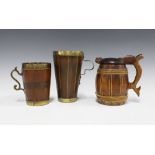 Treen / woodenware to include two coopered brass bound tankards and a Scandinavian tankard (3)