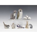 A group of eight Royal Copenhagen porcelain birds and animals to include an Owl, Cat, Hare and an