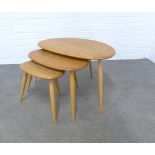 An Ercol light elm nest of three Pebble tables , 65 x 41 x 43cm.