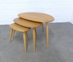 An Ercol light elm nest of three Pebble tables , 65 x 41 x 43cm.