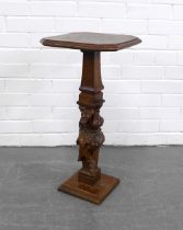 Carved oak and fruitwood table/stand, on a Jester figural column, 32 x 64cm.