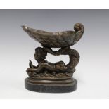 Bronze shell and cherub comport on an oval hardstone base, 21cm high