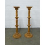 Pair of beechwood torchere stands, 24 x 100cm. (2)